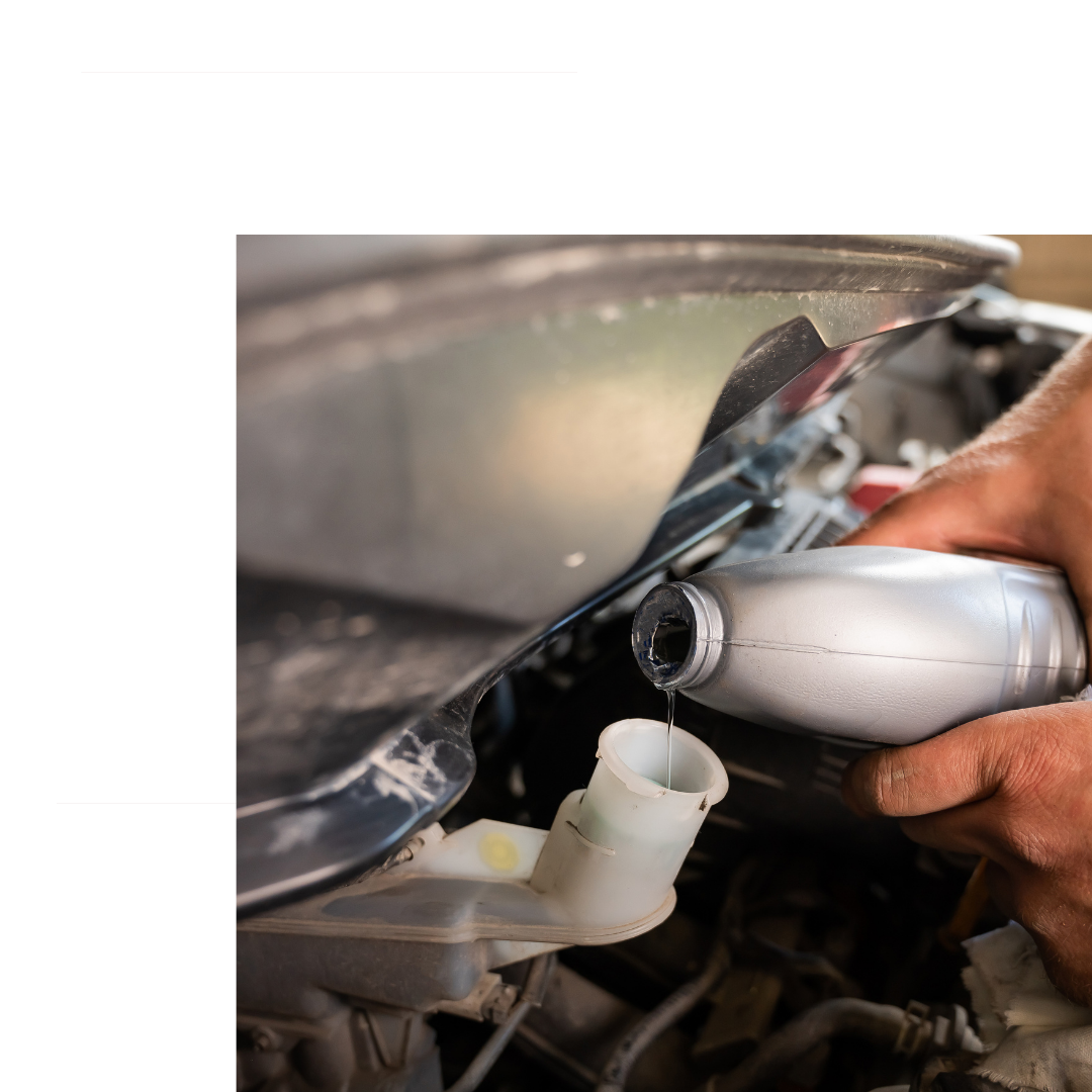 Pouring brake fluid.