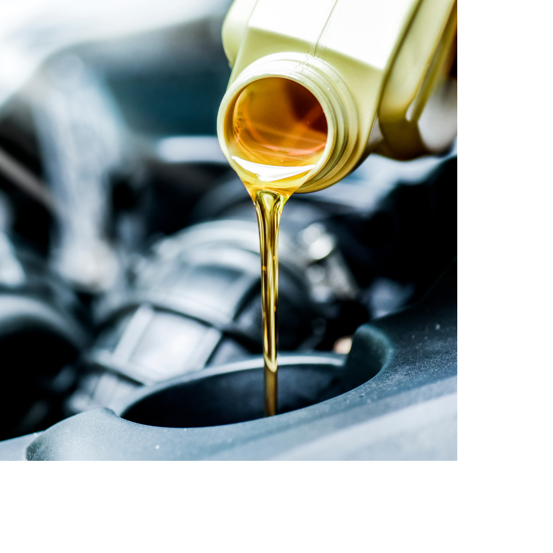 Oil pouring into a car from a bottle