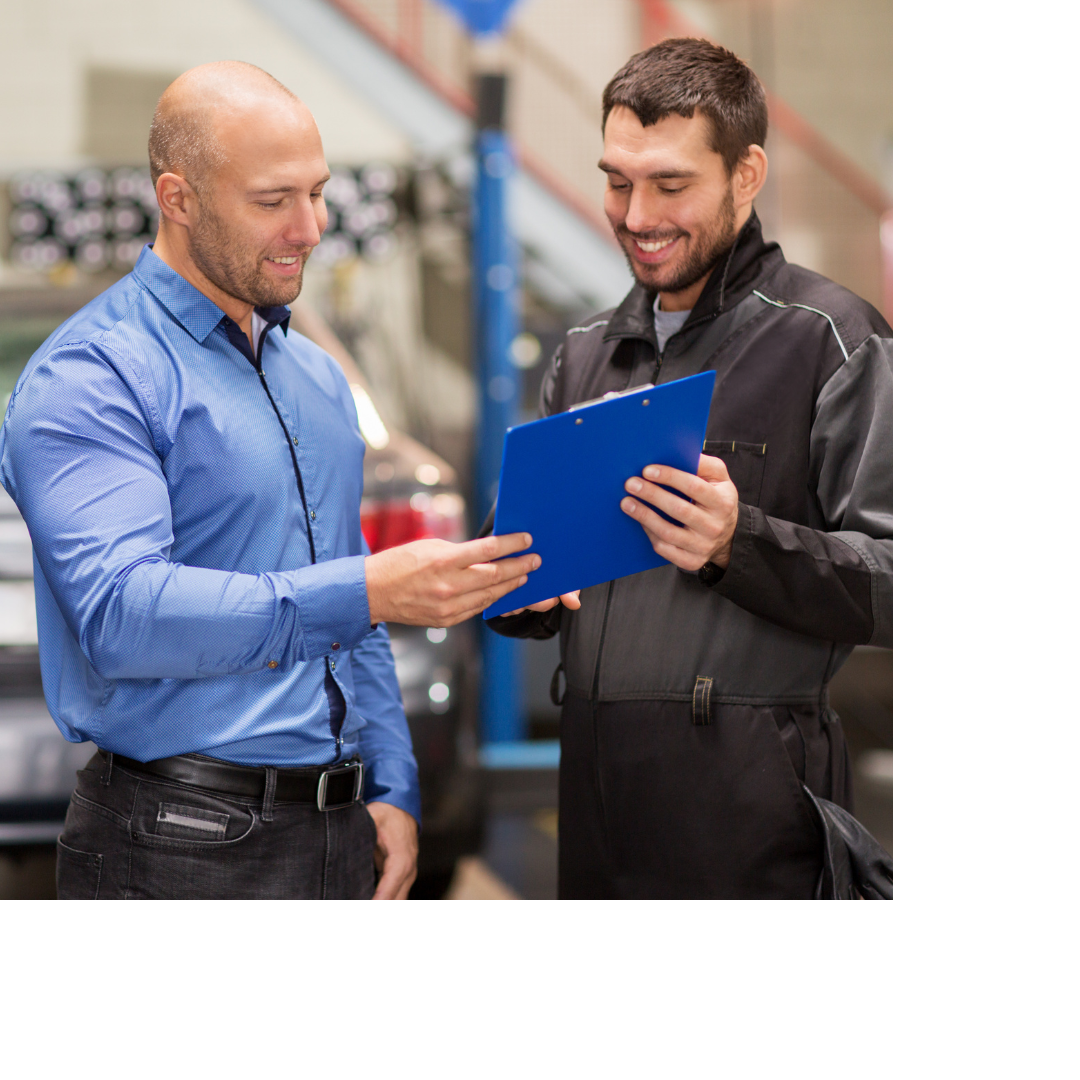 A mechanic talking and smiling with a customer