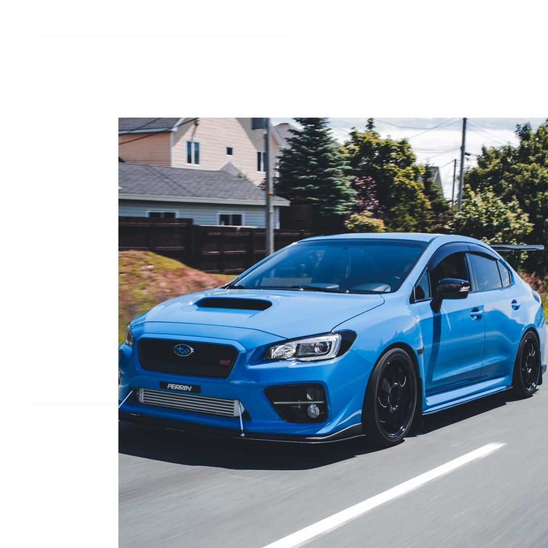 Blue Subaru on the road