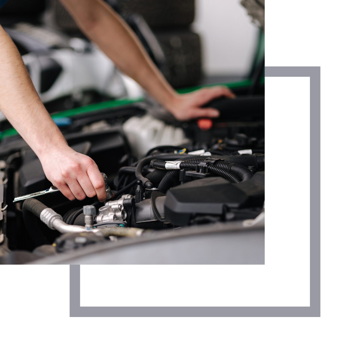 Mechanic working under the hood of a car